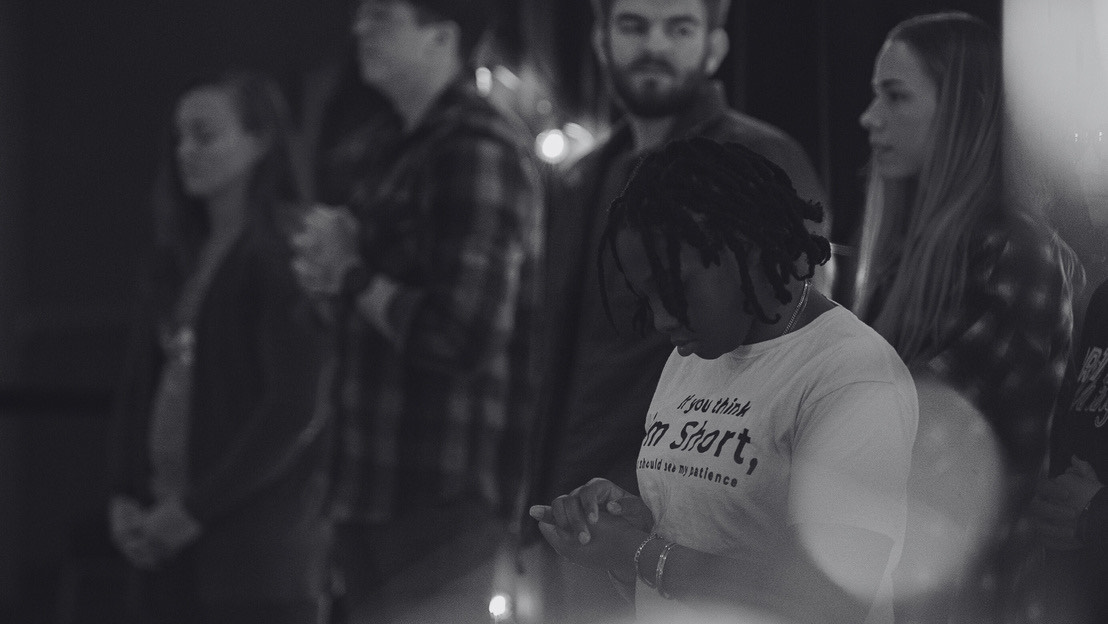 Students worshipping in the Multi-Purpose Room