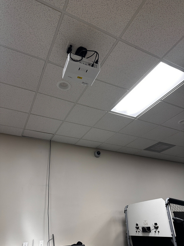 The rear projector mounted on the ceiling